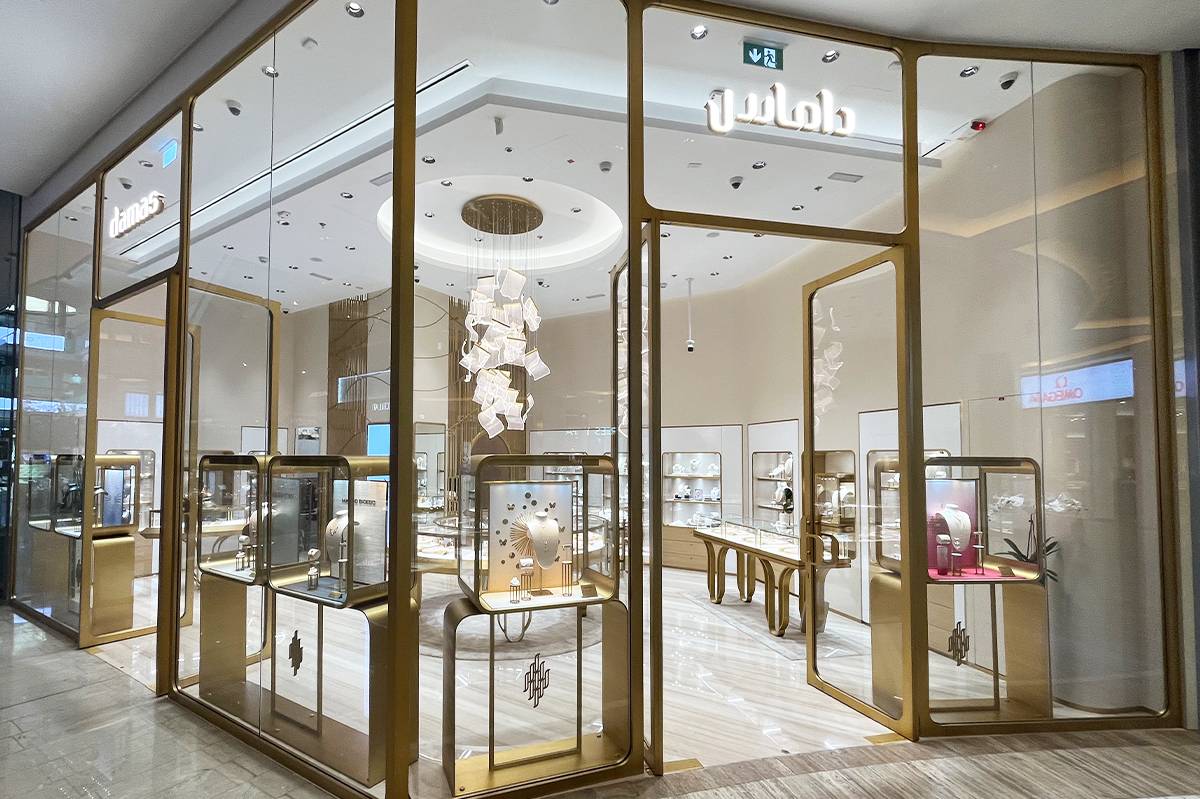 Flamy modern chandelier supplied by HDLS Lighting Ltd for Damas Jewellery boutique in the Middle East