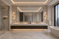 Alabaster Alba wall lights beside mirror in a luxury Manhattan bathroom with marble and brass finishes