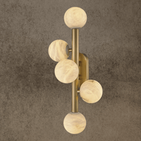 Luxury alabaster wall lamp with five carved alabaster globes on a vertical brass frame.