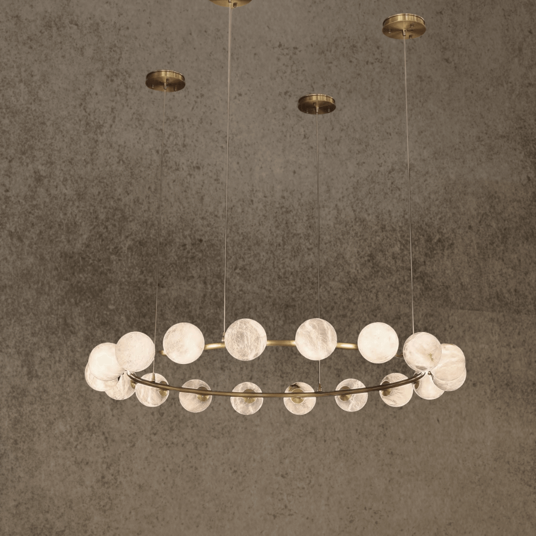 Luxury circular alabaster chandelier with 18 glowing spheres suspended from brass canopy.