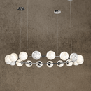 Brushed chrome Alabaster Galaxia chandelier featuring 18 glowing alabaster globes arranged on a circular frame.