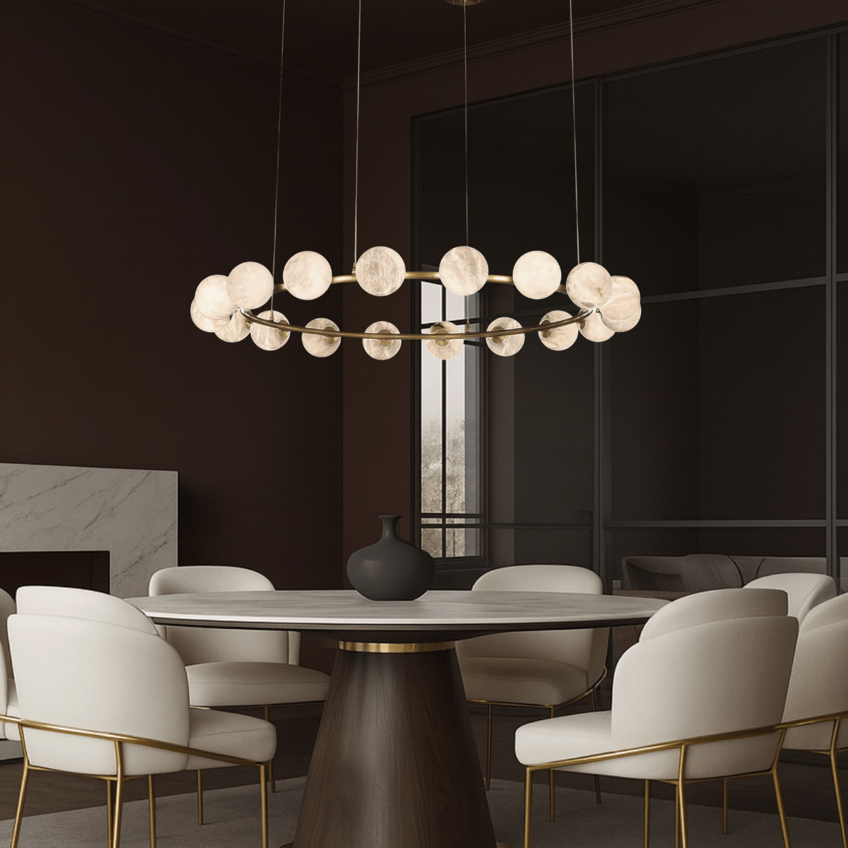 Galaxia alabaster chandelier illuminating a modern dining room with a round table.