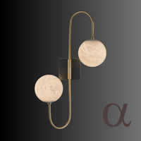 Alabaster Sfera Alpha wall sconce with two glowing alabaster globes and brass frame