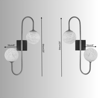 Alabaster wall lamp with measurements showing 64cm(25") height and 16cm (6") alabaster globes