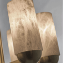Detailed view of hand-carved alabaster cylinder shade showing natural veining