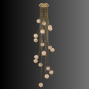 Multi-drop alabaster globe chandelier suspended from brass frame for double-height spaces