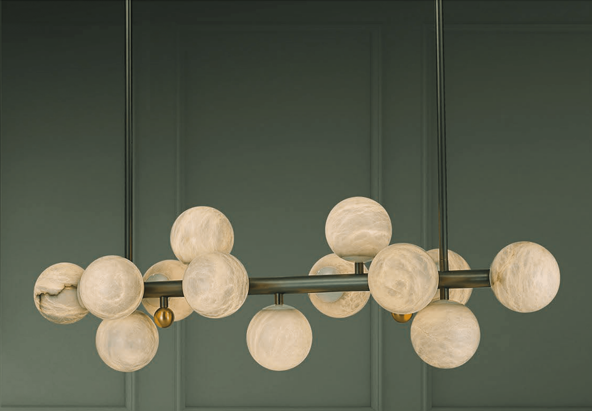 Close-up of the Alabaster Volta chandelier showing hand-carved alabaster globes.