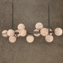 Luxury Alabaster Volta linear chandelier with Spanish alabaster globes and copper frame.
