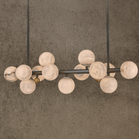 Luxury Alabaster Volta linear chandelier with Spanish alabaster globes and copper frame.