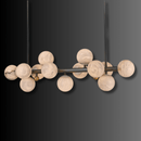 Modern linear chandelier with hand-carved alabaster globes in a sculptural copper design.