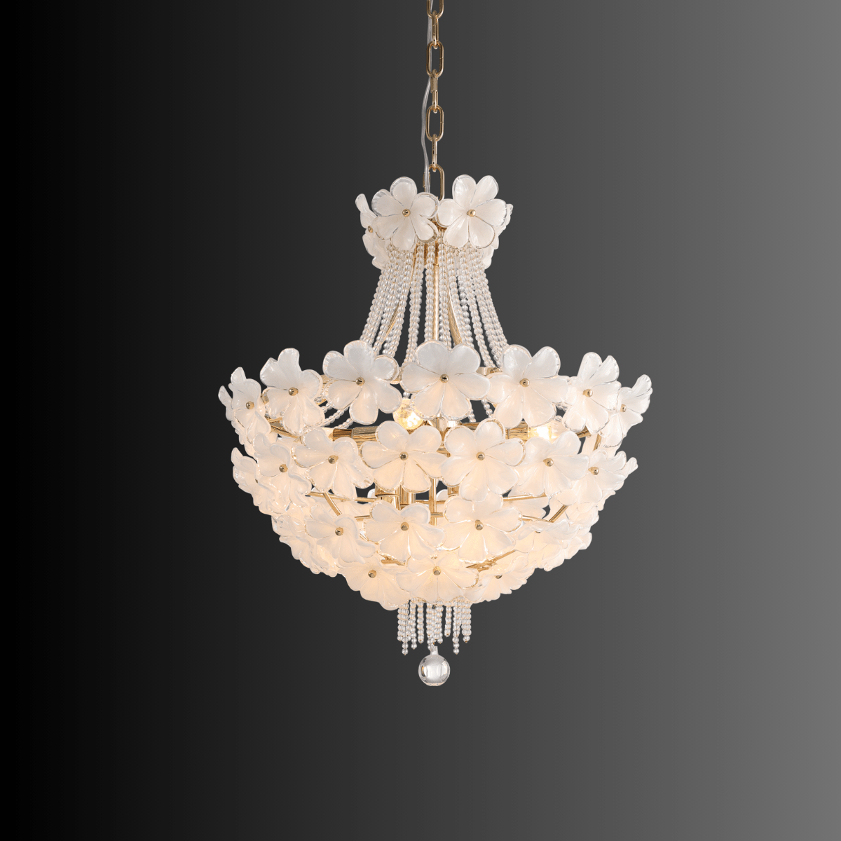 Smaller Camellia Bloom chandelier featuring white floral glass and gold metal frame.