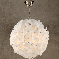 Camellia Fiorita Globe chandelier with white Murano-style glass flowers on a gold sphere.