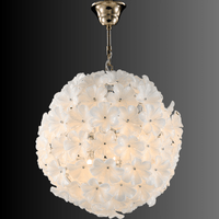 Murano-style floral globe chandelier by HDLS with white glass blooms and warm lighting.
