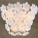 Luxury wall sconce with white Murano-style glass flowers on stainless steel frame by HDLS Lighting.