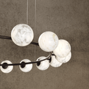 Detailed view of hand-carved alabaster spheres on the Matt Brown Galaxia ring chandelier.