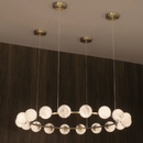 Brass ceiling canopies supporting the suspended Galaxia alabaster ring chandelier.