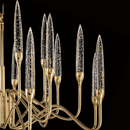 Close-up of champagne-cut crystal spires and gold detailing from the Luce di Roma Theia chandelier. 