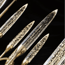 Angled view of handcrafted champagne crystal spires and 18K gold-plated arms from the Luce di Roma Theia.