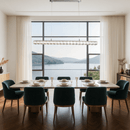 Halo Luxe Elara crystal pendant lighting a modern dining room with large windows and panoramic lake views.