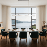 Halo Luxe Elara crystal pendant lighting a modern dining room with large windows and panoramic lake views.