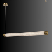 Alabaster Lumen linear pendant shown against a dark gradient background with brass-finished end caps.