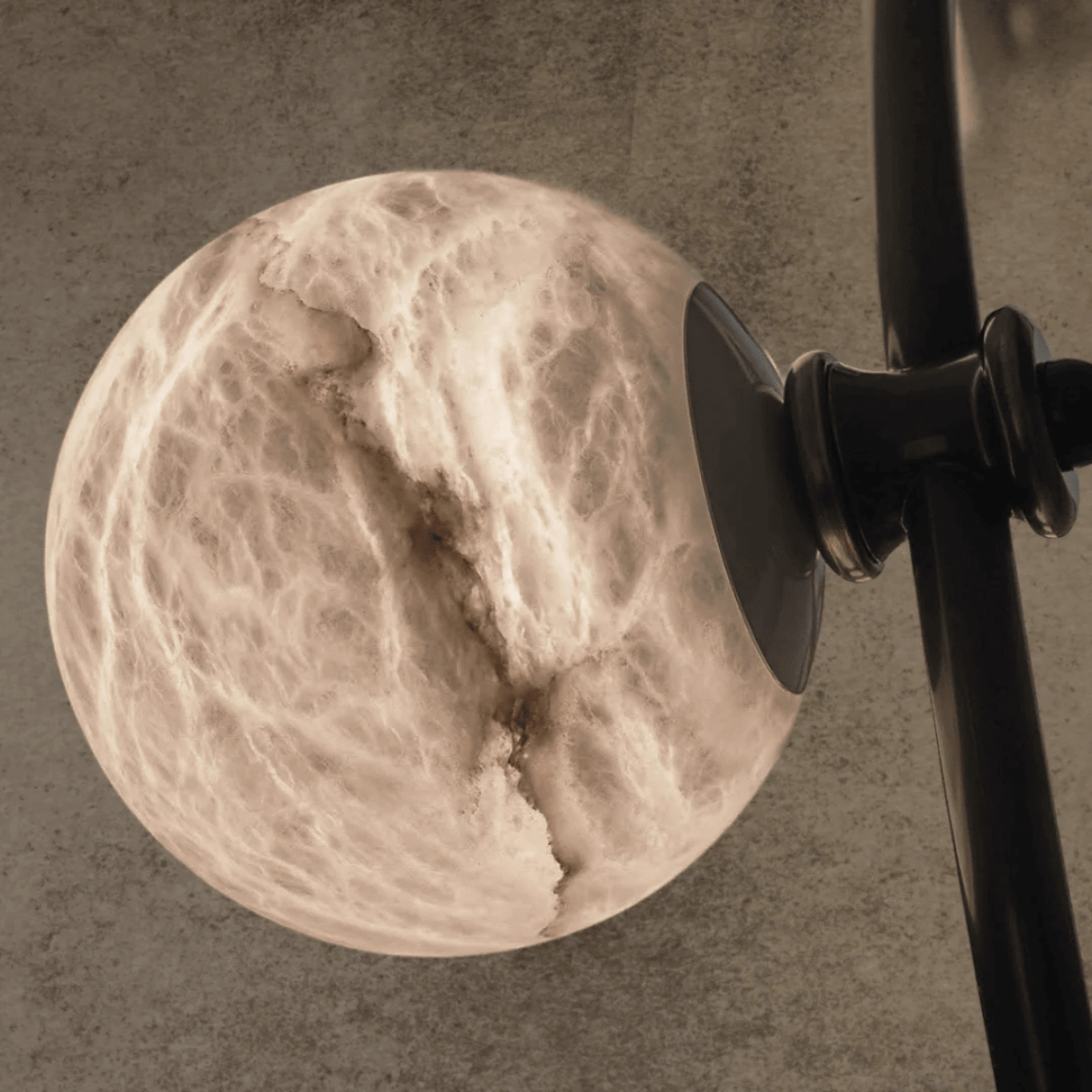 Macro detail of a natural alabaster globe showing veining and soft glow.