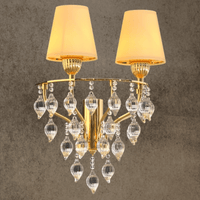 Two-light gold and glass Murano-style wall sconce with ivory shades by HDLS Lighting Ltd