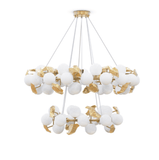 A luxurious modern chandelier featuring frosted glass orbs and gold accents with a durable copper body with white background.