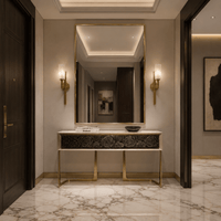 Alabaster Axis brass wall lights illuminating a luxury apartment entrance with marble flooring and mirror