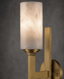 Close-up of Alabaster Axis Spanish alabaster wall light in brushed brass with natural stone cylinder