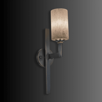 Vertical Spanish alabaster wall sconce in matt brown copper, tall with sculptural architectural form.