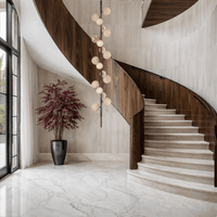 Luxury alabaster pendant light for modern curved staircase and high ceilings.