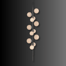 Modern vertical alabaster lighting with illuminated stone spheres on a copper frame.