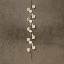 Vertical alabaster pendant light with Spanish alabaster spheres and copper body for staircases.