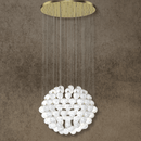 Large-scale alabaster chandelier with brass gold ceiling plate and natural stone spheres.