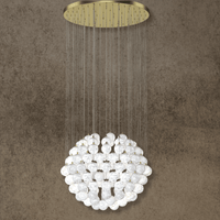 Large-scale alabaster chandelier with brass gold ceiling plate and natural stone spheres.