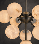 Close- up shot of the alabaster and metal parts of the Alabaster Novand chandelier.
