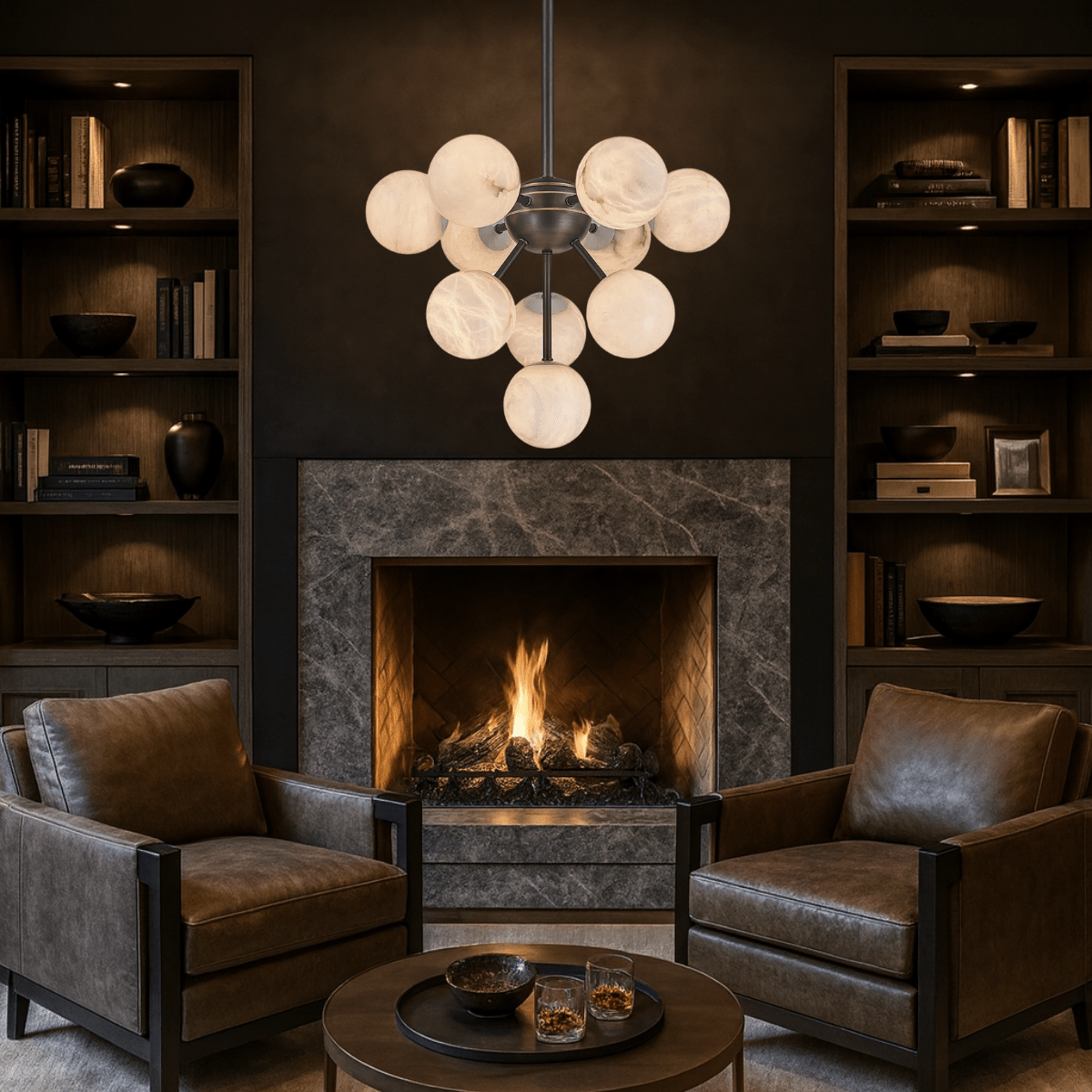 Alabaster Nova chandelier above a fireplace in a luxury dark-toned home library.