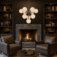 Alabaster Nova chandelier above a fireplace in a luxury dark-toned home library.