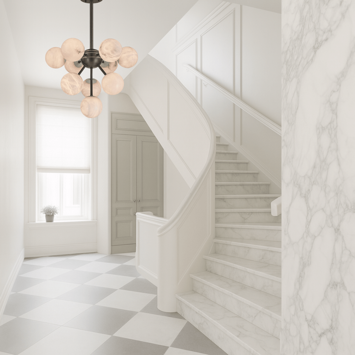 Alabaster Nova chandelier enhancing a white foyer with marble staircase and soft natural light.