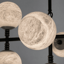 Close-up of illuminated Spanish alabaster sphere showing natural veining and stone diffusion.