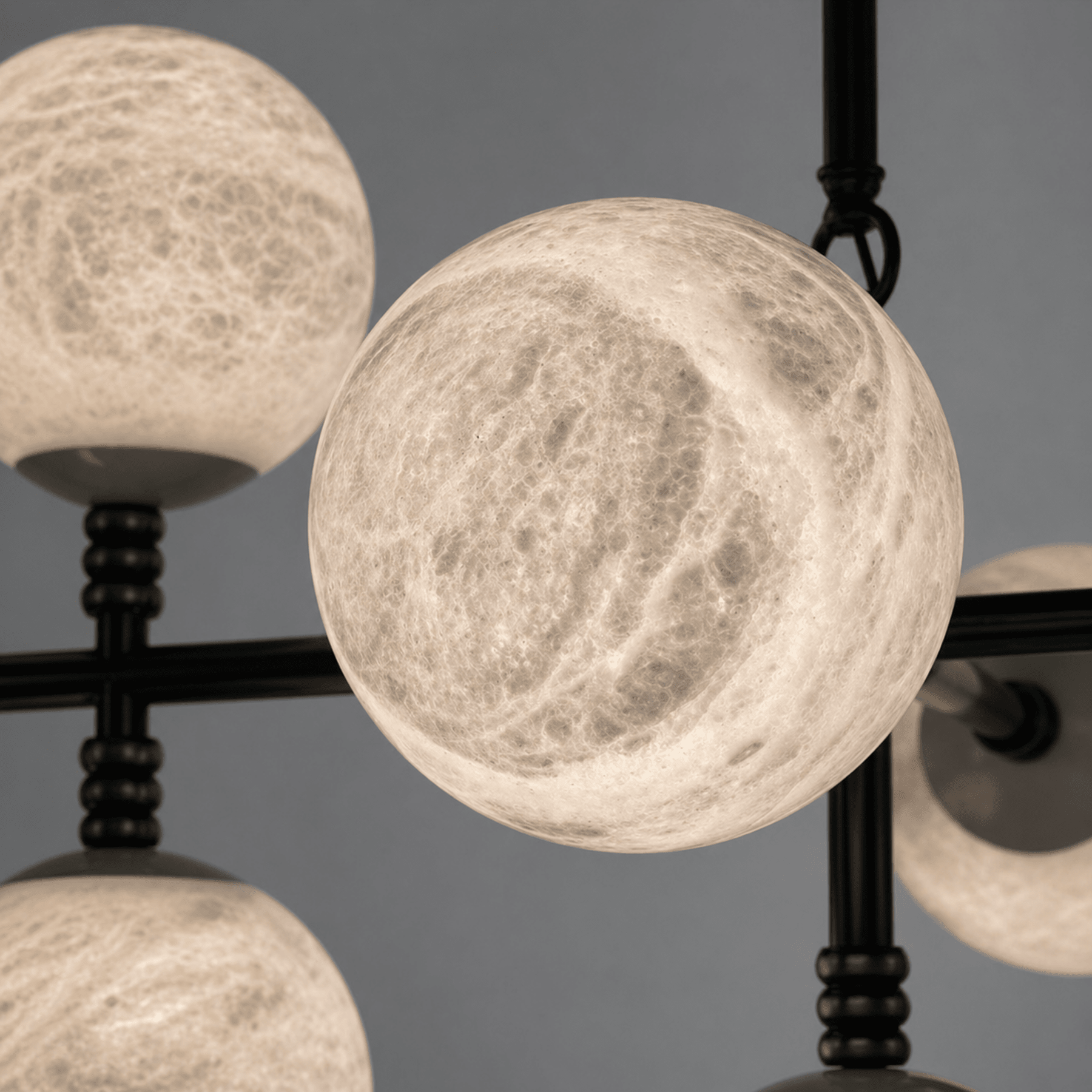 Close-up of illuminated Spanish alabaster sphere showing natural veining and stone diffusion.