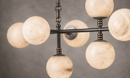 Close-up of illuminated Spanish alabaster sphere showing natural veining and stone diffusion.