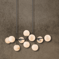 Linear Spanish alabaster chandelier with 10 stone spheres on solid copper bar, front view.