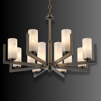 Architectural Spanish alabaster chandelier with radial copper arms shown against dark gradient background.
