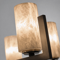 Close-up of illuminated Spanish alabaster cylinder showing natural veining and warm light diffusion.