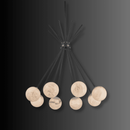 Luxury alabaster pendant light showcasing softly illuminated stone globes and architectural brass arms.