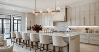 Alabaster linear pendant above kitchen island providing warm, architectural lighting