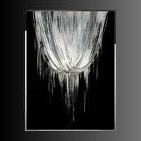 Asteria Swarovski crystal wall art installation with descending abstract crystal design in stainless steel frame.