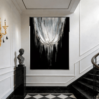 Asteria Swarovski crystal wall art installed in luxury staircase interior with architectural wall detailing.